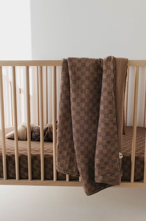 Introducing the Faded Brown Checker Crib Sheet - the perfect addition to your nursery! This crib sheet features a unique and stylish faded brown checkerboard design, adding a touch of sophistication to your little one's bedding. Made with soft and comfortable material for your baby's peaceful sleep. 100% muslin cottonCare Instructions : Machine wash with like colorsTumble dry on low or hang dryExclusively available at Forever French Baby Checkered Nursery, Muslin Quilt, French Baby, Checker Board, Muslin Swaddle, Solid Brown, Muslin Swaddling, Sleep Sacks, Crib Sheets