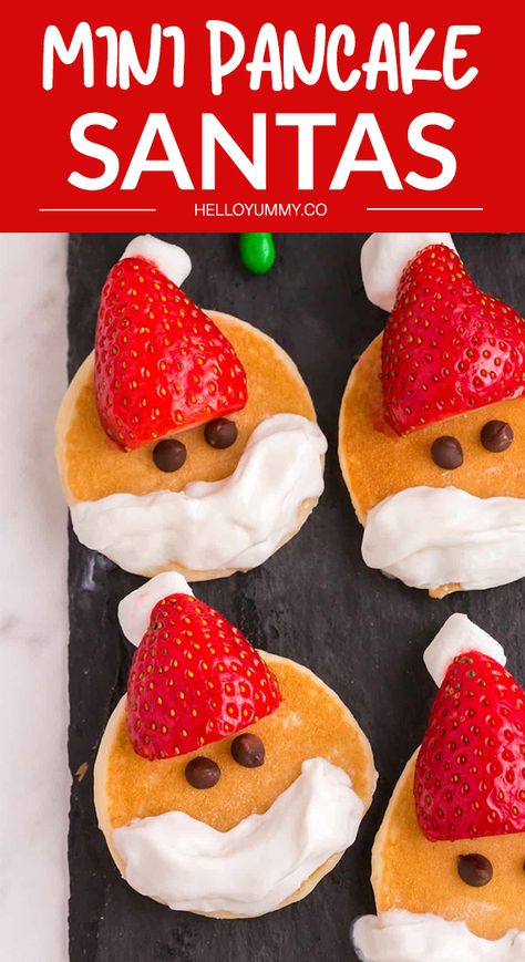 Christmas Charcuterie Dessert Board featuring Mini Pancake Santas. Cute and easy treat for kids. #helloyummy Preschool Brunch Ideas, Toddler Christmas Recipes, Easy Christmas Food Ideas For Kids, Christmas Food Art For Kids, Christmas Cooking For Kids Easy, Toddler Christmas Breakfast Ideas, Breakfast Board Christmas, Christmas Kids Breakfast Ideas, Fun Christmas Meals For Kids