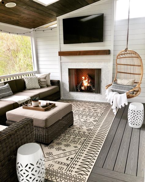 Screened in porch with shiplap gas fireplace, marble surround, composite decking, hanging egg chair and wicker sectional. Hanging Rattan Chair, Screened Porch Designs, Four Seasons Room, Porch Fireplace, Sunroom Designs, Cape Cod House, Screened In Patio, Outdoor Living Room, Porch Design