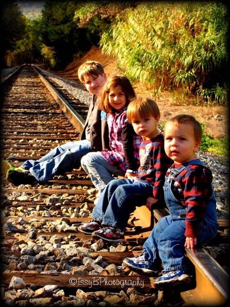 Railroad pictures. Watkins family <3 Railroad Track Family Photoshoot, Family Photos On Railroad Tracks, Family Railroad Photoshoot, Railroad Family Pictures, Railroad Family Photoshoot, Family Pictures On Railroad Tracks, Train Track Family Photoshoot, Railroad Photography Poses, Cousin Photo Shoots