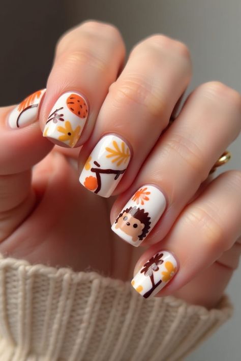 Nail design with autumn colors of orange, brown, and white
Leaf pattern on nails symbolizing fall
Small animal images incorporated for a playful effect Easy Fall Nail Designs For Beginners, Hedgehog Nails, Woodland Nails, Harvest Nails, Easy Fall Nail Designs, Owl Nails, Pattern Nail Art, Fox Nails, Nail Art For Kids