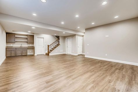 Light Wood Basement Floor, Basement With Laminate Flooring, Tile Floor Basement Ideas, Finished Basement Flooring, Downstairs Flooring, Evp Flooring, Basement Floor Ideas, Flooring Ideas Vinyl, Basement Flooring Ideas