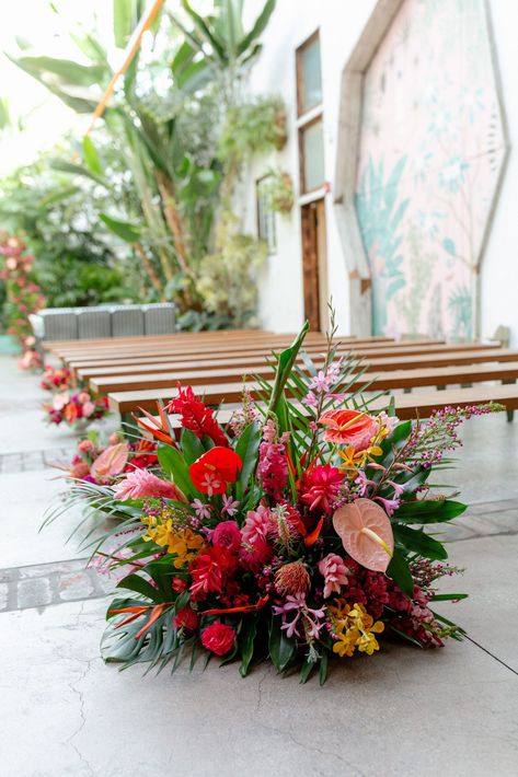 tropical inspired aisle floral arrangement #DTLAwedding #colorfulweddingplanner #tropicalinspiredwedding Tropical Wedding Flowers Ceremony Arch, Island Floral Arrangement, Tropical Wedding Aisle Flowers, Tropical Aisle Flowers, Whimsical Tropical Wedding, Modern Tropical Wedding Flowers, Tropical Ceremony Arch, Tropical Floral Design, Tropical Glam Wedding Decor