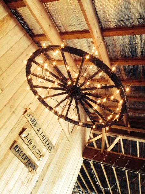 wagon wheel chandelier :)                                                                                                                                                      More Wagon Wheel Light Diy, Wagon Wheel Lights Chandeliers, Wagon Wheel Chandelier Wedding, Barn Chandelier Ideas, Wagon Wheel Light Fixture, Diy Wagon Wheel Chandelier, Wagon Wheel Chandelier Diy, Diy Wagon Wheel, Wheel Light Fixture