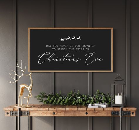 Christmas signs, Wood signs for Christmas, May You Never Be Too Grown Up To Search The Skies on Christmas Eve Size Options:  10"tall, 20"wide 12"tall, 24"wide 14"tall, 26"wide 16"tall, 32"wide 20"tall, 40"wide Background and Text Options: White with black text  Black with white text Gray with white text Red with white text Green with white text Frame options: All frames are made from pine that we personally hand pick and mill.  All frames are colored with stain- White Pine, Natural, Classic Brow Above Tv Christmas Decor, Christmas Bar Decor, Large Christmas Signs, Christmas Decor Signs, Christmas Wall Decor Ideas, Signs For Christmas, Wide Background, Laser Christmas, Glow Forge