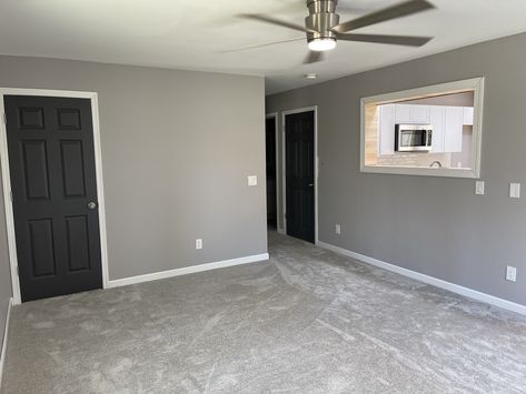 Gray Walls Gray Doors, Gray Interior Trim And Doors, Dark Doors With White Trim Grey Walls, Black Interior Doors With Gray Walls, Grey Room Black Trim, Grey Walls And Black Doors, Light Grey Walls With Black Trim, Dark Gray Trim Interior, Dark Interior Doors With White Trim