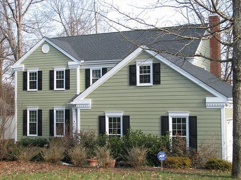 Light Green Vinyl Siding | Light green siding/black shutter combo Green Vinyl Siding, Green House Exterior, Exterior Siding Colors, Green Siding, Exterior Paint Schemes, Exterior House Siding, Wood Siding Exterior, Green Shutters, Black Shutters