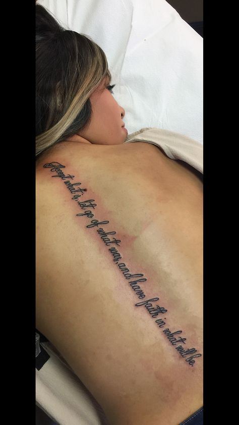 Spin Quote Tattoos, Song Lyric Tattoos Spine, Spine Tattoos Script, Spine Saying Tattoos For Women, Rare Spine Tattoos For Women, Quote Down Spine Tattoo, Bible Quote Spine Tattoo, Bible Spine Tattoo, Spine Tattoo Bible Verse