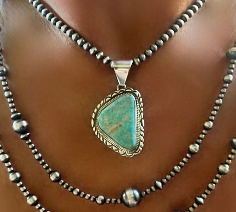 This beautiful pendant is a stunning example of Native American artistry. Handmade by Navajo artisan Skeets, it features a flawless natural turquoise stone set in a .925 sterling silver frame. The pendant showcases the beauty of nature with its intricate design and vibrant light blue color. Perfect for anyone, this piece is a unique addition to any jewelry collection. It is certified as handmade and Native American, reflecting the rich cultural heritage of the United States. Add a touch of natur Vintage Navajo Jewelry, Bohemian Cowgirl, Silver Turquoise Jewelry, Fashion Future, Natural Turquoise Stone, Turquoise Jewelry Native American, American Indian Jewelry, Reno Nv, Native American Heritage