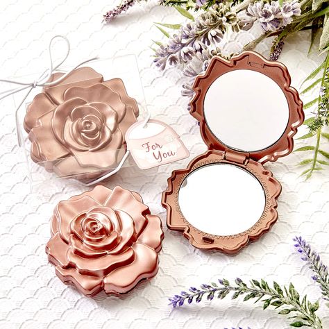 PRICES MAY VARY. Travel Makeup Mirror: Our beautiful rose design compacts feature a case made of hard molded plastic, finished in a dusty rose color. The cover's two dimensional molded 'petals' bring the beautiful rose blossom design to life. Cosmetic Mirror: The compact mirror opens with a side hinge to reveal a dual sided glass mirror inside and is ideal for makeup applications. Party Favor: This exquisite favor is presented in a clear display box with a white string elastic wrap and bow. Atta