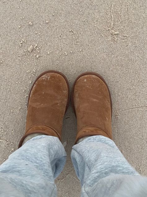 Aesthetic ugg boots, beach, sand, aesthetic beach, winter, trackies Uggs On The Beach, Beach Sand Aesthetic, Ugg Cluggette, Sand Aesthetic, Beach Winter, Slippers Outfit, Winter Shoot, Uggs Outfit, Aesthetic Beach