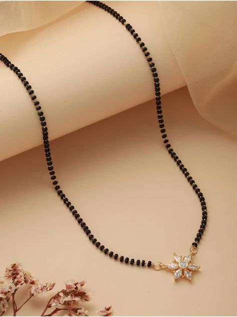 Buy beautiful and charming mangalsutra chains from our gold and diamond collection. Karimani Chain Designs, Short Mangalsutra Designs Gold, Small Mangalsutra, Mangalsutra Designs Gold, Emerald Stone Rings, Mangal Sutra, Mangalsutra Chain, Mangalsutra Design, Black Beads Mangalsutra