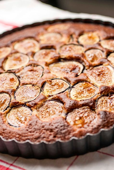 NYT Cooking: Figs are baked into an almond batter for this rustic cake to have with coffee or tea. With figs, ripeness is everything. A ripe fig (the object of your desire) is soft, yielding, beginning to crack, nearly wrinkled. When you cut into it, the flesh is bright and juicy and the taste is ethereal. Pear And Almond Cake, Fig Cake, حلويات عربية, Almond Cake Recipe, Fig Recipes, Slow Cooker Desserts, Almond Cake, Nyt Cooking, Fresh Figs