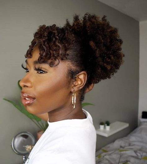 20 Hottest Afro Puff Hairstyles Worth Trying in 2023 Afro Puff With Bangs, Drawstring Afro Puff Hairstyles, Afro Puff Hairstyles Black Women, Puffs Hairstyles, Natural Puff Hairstyles, High Afro Puff, High Puff Hairstyles, Puff Hairstyle, Puff Hairstyles