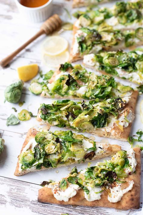 Sautéed Brussels sprouts, nestled on a bed of ricotta cheese with a honey drizzle: what's not to love? #vegetarianflatbread #vegetarianflatbreadrecipe #brusselssproutsrecipe #brusselssproutsflatbread #flatbreadrecipe Brussels Sprout Flatbread, Vegetarian Flatbread Recipes, Honey Brussel Sprouts, Vegetarian Flatbread, Sautéed Brussels Sprouts, Goats Cheese Flatbread, Ricotta Cheese Recipes, Honey Drizzle, Recipe Journal