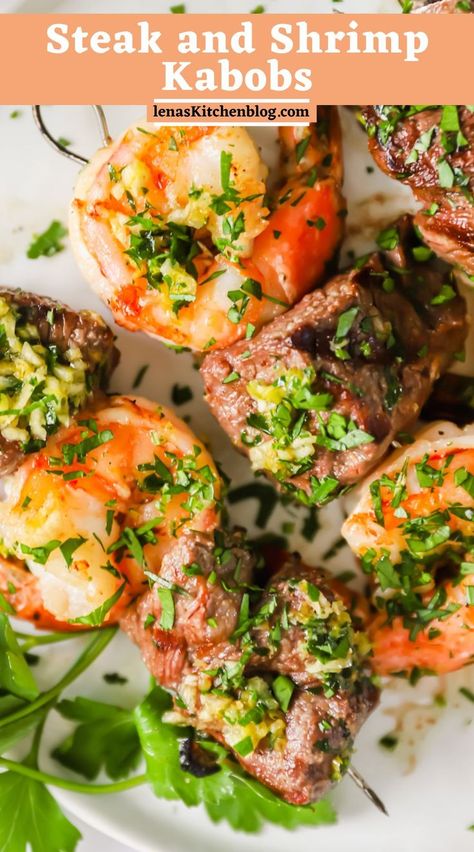 These Steak and Shrimp Kabobs are bursting with savory, juicy, and zesty flavors! The combination of succulent steak cubes, tender shrimp, and homemade garlic butter is a true surf and turf crowd-pleaser. Serve them with a side of fresh greens or grilled veggies for the ultimate backyard barbecue feast! Surf And Turf Kabobs, Steak And Shrimp Kabobs, Veggie Kabobs, Shrimp Kabobs, Cubed Steak, Homemade Garlic Butter, Ultimate Backyard, Steak And Shrimp, Surf And Turf