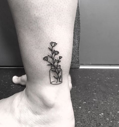 Simple flowers in a jar done by @inkyal | www.otziapp.com Canning Jar Tattoo, Flowers In A Pot Tattoo, Jar Of Flowers Tattoo, Small Jar Tattoo, Flowers In A Bottle Tattoo, Flowers In Jar Tattoos, Jar Tattoo Design, Jar Tattoo, Jam Jar Tattoo