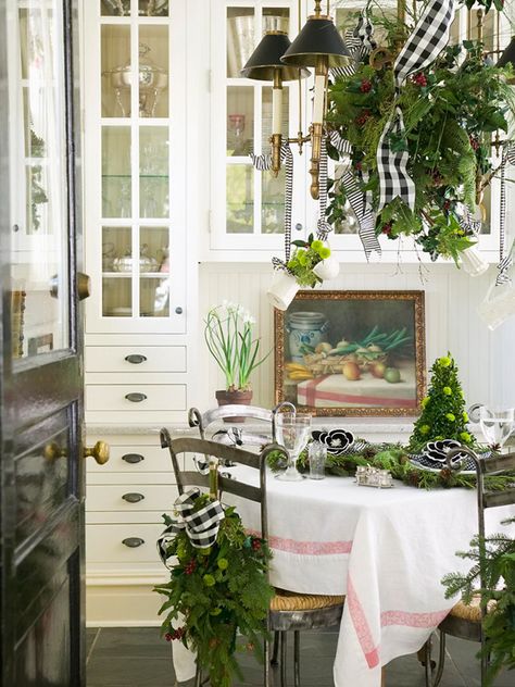 Christmas tablescape with lush greenery, black and white ribbons | Mary Carol Garrity Holiday House Tours, Midwest Living, Christmas Cottage, Cottage Christmas, The Dining Room, Christmas Kitchen, Noel Christmas, Holiday Decorating, Country Christmas