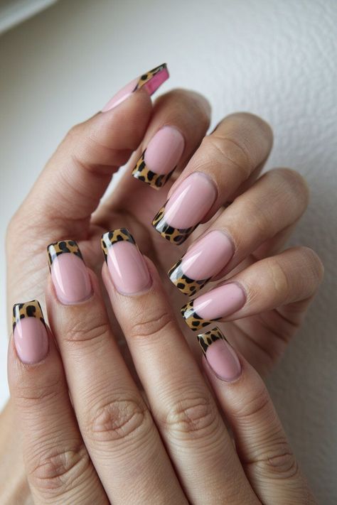 The photo shows a hand with medium-length nails featuring a modern French tip design. The nails have a natural pink base with tortoiseshell tips. French Tip Ideas, Tip Nail Designs, Ombre French Tips, Glitter French Tips, French Tip Design, French Tip Nail Designs, White French Tip, Nail Pops, French Nail Art