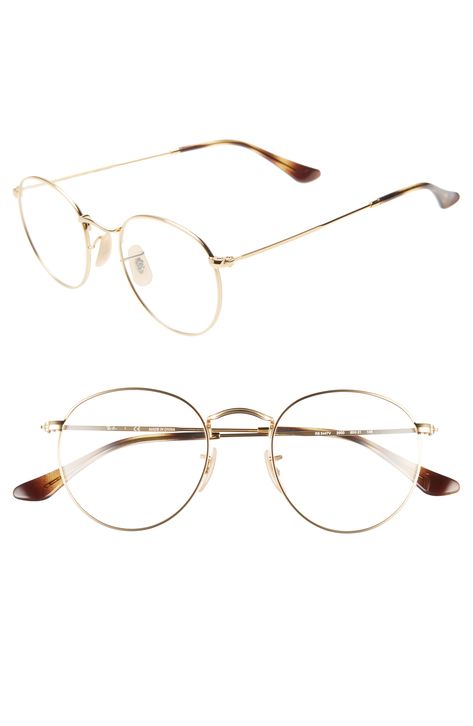 Shop Ray Ban 50mm Round Optical Glasses - Gold from 250+ stores, starting at €163. Similar ones also available. On SALE now! A rounded silhouette amplifies the retro-chic appeal of subtly textured metal frames styled with slim temples and an angular bridge. Style Name: Ray-Ban 50Mm Round Optical Glasses. Style Number: 5765239. Available in stores. Specs Frame, Ray Ban Round Metal, Gold Eyeglasses, Fake Glasses, Ray Ban Women, Round Ray Bans, Gold Glasses, Round Frame Sunglasses, Metal Glasses