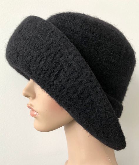 "Black Felted Flapper Cloche Hat with a 3 1/2\" Extra wide brim adorned with a 1\" felted hat band.  Will take up to 2 weeks to make.   If you prefer a narrower brim (2 1/2\" or 3\" ) please let me know in the comment box when ordering. This is the perfect hat for the woman who needs sun protection even in during the Winter Season.  The size options are located in the pull down above. If you are in between sizes, choose the size up. (Size hat on mannequin's 21 1/2\" head is 25\").   ✨✨To measure Cappello Cloche, Art Deco Hats, Flapper Cloche, Bohemian Hats, Wool Cloche Hat, Felted Hat, Cloche Hats, Hat Art, Flapper Hat