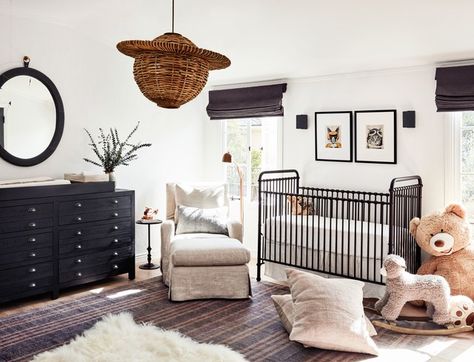 a crib and big armchair in a nursery, modern, minimal, neutral colors, layered rugs Gender Neutral Nursery Inspiration, Nursery Inspiration Neutral, Metal Crib, Nursery Baby Room, Wood Dresser, Gender Neutral Nursery, Spanish Colonial, Baby's Room, Nursery Inspiration