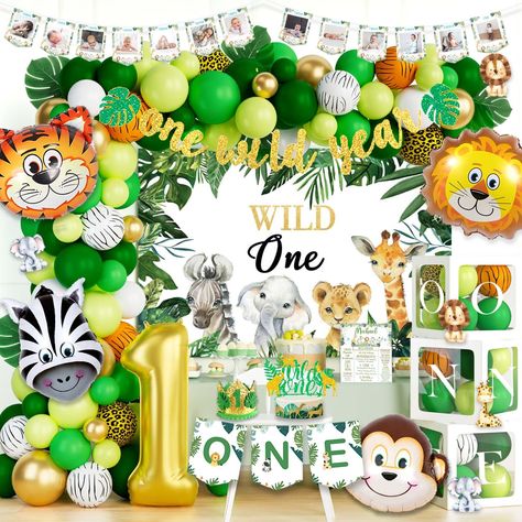 PRICES MAY VARY. 🦁 Wild one adventure – Your little guy is turning one! A safari-themed party is the best way to celebrate for your little explorer’s first birthday. Lion, tiger, zebra, and plenty of tropical greenery, this mix creates a relaxing and comfortable natural mood. Is your little guy ready to have this wild one adventure? 🐮 WILD ONE BIRTHDAY DECORATIONS INCLUDES - 1 x backdrop |2 x banners | 60 x 12’’ green latex balloons | 5 x 12’’ metallic gold balloons | 15 x 12’’ animal print la Wild One Birthday Party Boys, Jungle Garland, Wild One Birthday Decorations, Party Decor Backdrop, 1st Birthday Decorations Boy, Safari Theme Birthday Party, Backdrop Balloons, Balloon Boxes, Jungle Balloons