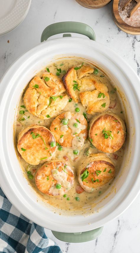 Slow Cooker Chicken Pot Pie is filled with veggies and topped with freshly baked biscuits. - The Magical Slow Cooker Chicken Pot Pie Slow Cooker Crockpot, Crock Pot Chicken Pot Pie Recipes, Slow Cooker Chicken Pie, Chicken Pot Pie Crock Pot With Biscuits, Chicken Pot Pie Crockpot Recipes, Slow Cooker Pot Pie Chicken, Slow Cooker Chicken And Biscuits, Crock Pot Chicken Pot Pie With Biscuits, Easy Crockpot Chicken Pot Pie With Biscuits