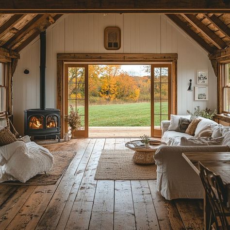 Cozy rustic living room with wood-burning stove, wooden flooring, and autumn view Cozy Rustic Living Room, Large Glass Doors, Different Types Of Houses, Barn Loft, Cottage Renovation, Beautiful Cabins, Countryside House, Small Cabin, Grandmas House