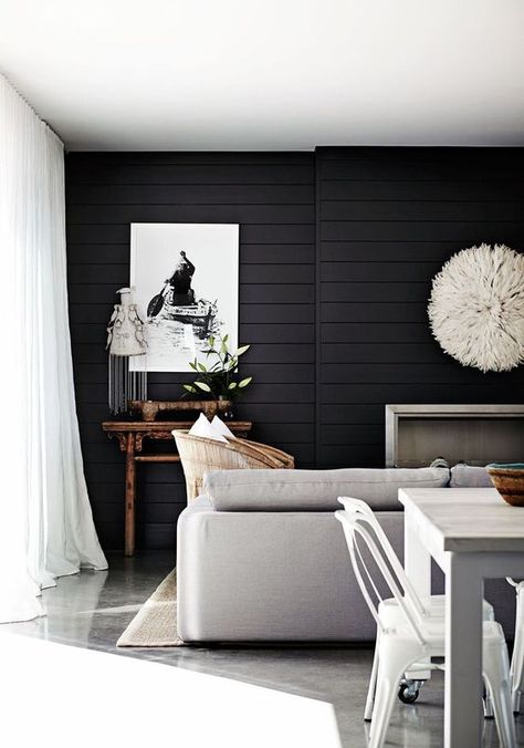 a Scandinavian living room with a black shiplap accent wall that makes a statement in this neutral space Shiplap Living Room, Dark Accent Walls, Tongue And Groove Walls, Black Accent Walls, Dark Paint Colors, Shiplap Accent Wall, Revere Pewter, White Shiplap, Small Space Design