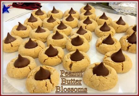 Hershey's Peanut Butter Blossom Cookies Recipe Pecan Pie Cookie, Peanut Blossom Cookies, Peanut Butter Blossoms Recipe, Hershey Kiss Cookies, Classic Christmas Cookies, Peanut Butter Blossom, Peanut Blossoms, Pecan Pie Cookies, Peanut Butter Blossom Cookies