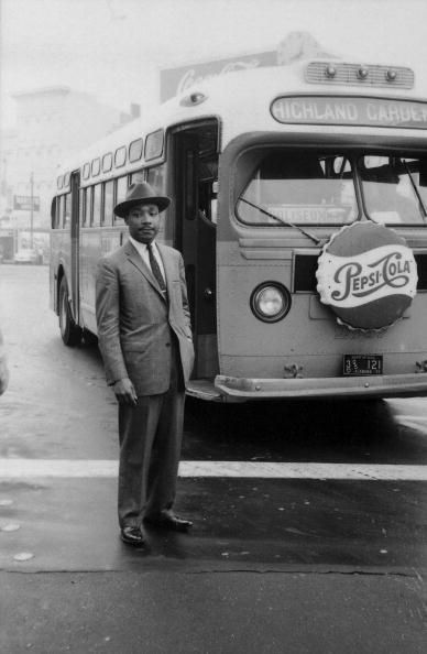 American Civil Rights leader Reverend Martin Luther King Jr stands in front of a bus at the end of the Montgomery bus boycott Montgomery Alabama... Montgomery Bus Boycott, Bus Boycott, Gil Scott Heron, Coretta Scott King, Man In A Suit, Dr Martin Luther King Jr, Unapologetically Black, Mlk Jr, Dr Martin Luther King