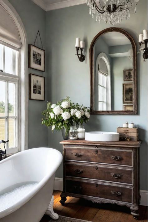 Distressed wooden vanity, rustic shelves, and mason jar organizers in a bathroom Rustic Blue Bathroom, Small French Country Bathroom, Diy Projects Using Pallets, Rustic Bathroom Ideas, Bathroom On A Budget, Decor Makeover, Wood Bathroom Cabinets, Elegant Bathroom Design, Simple Diy Projects