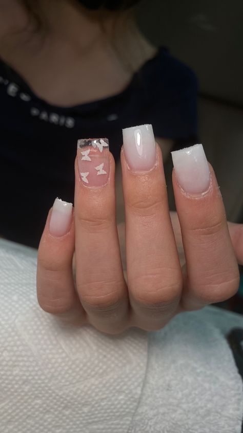 Milky white shirt nails with accent ring finger that has white butterfly glitters encapsulated in clear White Clear Nails Acrylic, Short Milky White Acrylic Nails, Spring Time Nails Acrylic, Spring Time Nails, Glitter Toe Nails, Senior Hoco, Time Nails, Brown Nails Design, Clear Acrylic Nails