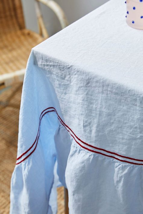 Designed by Issy Granger and crafted by artisans from light linen, this tablecloth brings effortless elegance to the table with its crisp double piped details. Mix and match this versatile design with napkins in any shade and pattern. Product Details 100% European linen. Woven in Portugal. Care Instructions Wash with similar colors. Size & Fit Small: 70.86" W x 98.42 L Medium: 70.86" W x 118.11" L Large: 70.86" W x 137.79" L Shipping Details Please allow 5-7 days for standard delivery. Return Po Cards On The Table, Christmas Decs, Vase With Lights, Colour Ways, Christmas Gift Card, Bespoke Gifts, Candle Cup, Russian Fashion, European Linens