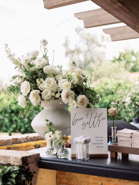 Potted Greenery Wedding, Large White Centerpiece Wedding, Wedding Flower Pots Outdoor, Large Vase With Greenery, Low White Centerpiece Wedding, Ranunculus Table Arrangement, Bar Flower Arrangement Wedding, September Florals Wedding, Wedding Flower Vases