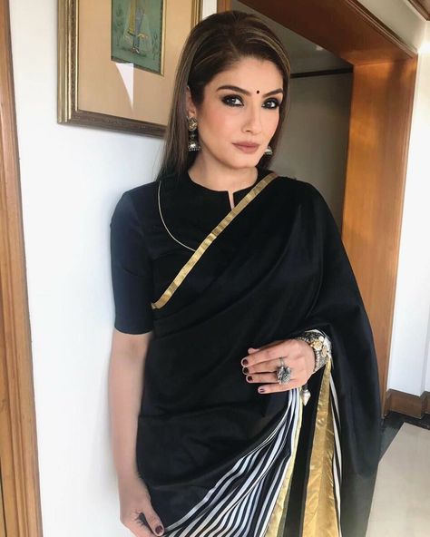 Ravina Tandon in Black saree Flower Print Suits Design, Office Saree Blouse, Closed Neck Blouse Designs, Close Neck Blouse Designs, High Neck Blouse Designs, Saree Styling, Blouse Designs High Neck, Party Wear Dress, Mini Prom Dresses