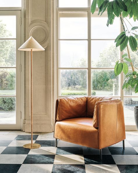 Lighting that pushes the limits of scale, shape and material—it's all about picking pieces with personality. Tap to shop lighting. Leather High Back Chair, Modern Leather Lounge Chair, Chicago Condo, White Marble Side Table, Minimalist Frame, Condo Design, Brown Leather Sofa, Brass Patina, Leather Accent Chair