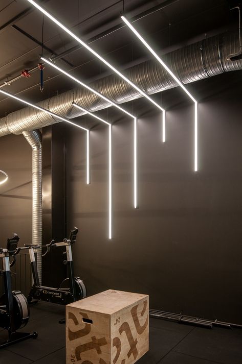 Fitness Centre Interior Design, Neon Gym Interior, Spinning Studio Design, Calisthenics Gym Design, Gym Lighting Ideas Ceilings, Commercial Gym Design Interiors, Gym Lighting Ideas, Gym Lobby, Gym Lights