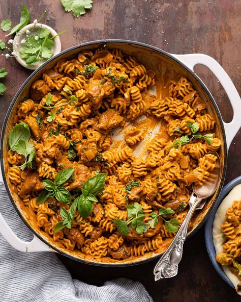 This Butter Chicken Pasta is my twist on an Indian classic. The pasta is tossed in a rich spiced tomato cream sauce and is loaded with tender chicken thighs. Everything you love about a classic butter chicken, but swap the rice for pasta. It all comes together in only about 30 minutes too! Butter Chicken Tacos, Chicken Tikka Pasta, Butter Chicken Pasta Recipes, Chicken Thigh Pasta, Chicken Enchiladas Easy Red Sauce, Red Sauce Chicken Enchiladas, Pasta Bites, Easy Red Sauce, Red Sauce Chicken