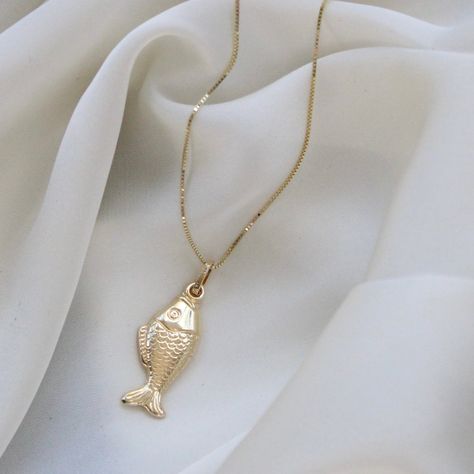 14K Solid Gold Fish Necklace . . . * Gold KT: 14K Gold  * Gold Color: Yellow Gold * Chain: 1mm Rope Chain * Stamp: 14k * Never gold filled or plated * Packaged With Free Gift Box . . . PENDANT Measurements: * Small: With Bail 23mm X 7mm Without Bail: 17mm X 8mm * Medium: With Bail 32mm X 12mm Without Bail: 27mm X 7mm . . . If you have any questions, just hit the "Message the Seller" button ( bottom right of the page) and we will get back to you within a few hours. . . . Check our Social Media @T Ocean-inspired Gold Pendant Necklace, Tiny Fish Necklace, Fish Necklace Gold, Fish Locket In Gold, Gold Fish Necklace, Luxury Gold Fish-shaped Necklace, Heart Jewellery, Lucky Jewelry, Christmas Gifts For Sister