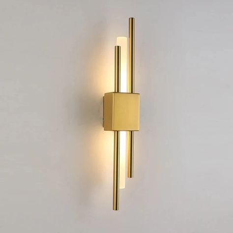 The Sparone Wall Sconce features a striking design with sleek metallic bars in a gold finish, providing an elegant yet contemporary look.💡 Its integrated LED lighting offers energy-efficient illumination, perfect for accentuating hallways, living rooms, or bedrooms with a touch of modern sophistication. #interiordesign #interiordesignideas #lampsdesign #homedecor #homedecorideas Hallway Wall Sconces, European Lighting, Contemporary Wall Lights, Bedside Wall Lights, Metal Wall Lamp, Hallway Wall, Iron Lighting, Modern Light Fixtures, Beautiful Lighting