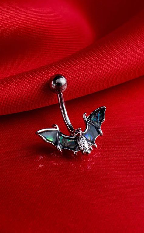 Created from 316L surgical steel, this beautiful piece has a bat with wings made from genuine abalone shell, and a curved barbell stud making it perfect for the navel. Material: Surgical Steel. Type: Belly Ring. Gauge: 14G. Length: 10mm. Colour: Silver & Abalone. Suitable Piercing: Upper Belly Button & Lower Belly Button. Frog Belly Button Ring, Belly Piercing Jewelry Silver, Punk Belly Button Piercing, Spider Belly Button Ring, Bat Belly Button Piercing, Dragonfly Belly Button Piercing, Belly Button Jewellery, Goth Belly Button Piercing, Curved Barbell Jewelry