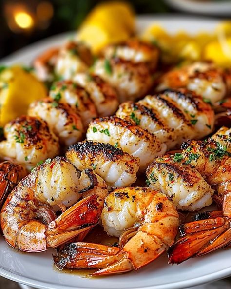 "WOULD YOU DIVE INTO THIS SIZZLING 🍤 Grilled Lobster and Shrimp 🦞? Savor the Freshness of the Sea! Quick to prepare, perfect for a busy lifestyle, and bound to impress at any family gathering. 🍽️ Ingredients 🍽️ - 4 tablespoons unsalted butter, melted - 1 teaspoon paprika - 1 tablespoon fresh parsley, chopped - 2 tablespoons fresh lemon juice - 4 cloves garlic, minced - 4 tablespoons olive oil - 1/2 teaspoon black pepper - 1 pound large shrimp, peeled and deveined - 2 lobster tails - 1/2 tea... Lemon Pepper Fish, Food Aversion, Lobster And Shrimp, Stadium Food, Brooklyn Food, Food Nyc, Sea Foods, Food Near Me, Grilled Lobster