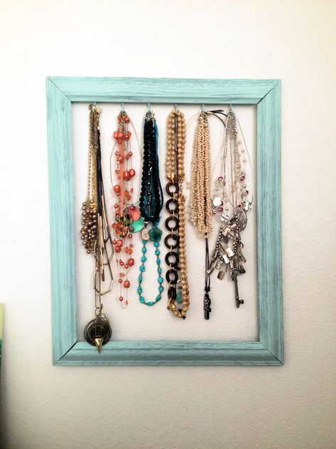 I would like you to tell the story of this exceptional DIY jewelry holder project that helped a lot in the easy and classy organization of my necklaces. I used to hang the necklaces on the wall nails, it worked for me with no issue, but soon I realized that I have to spice my jewelry storage game. So, I came with this DIY necklace holder idea, it is super inexpensive, and it made me feel proud, too, when I put my old frame to new creative use. You may also be having some old picture frames at Diy Necklace Holder Stand, Diy Jewelry Holder Frame, Necklace Organizer Diy, Diy Necklace Holder, Diy Necklace Display, Jewelry Storage Diy, Diy Xmas Gifts, Diy Jewelry Holder, Diy Collier