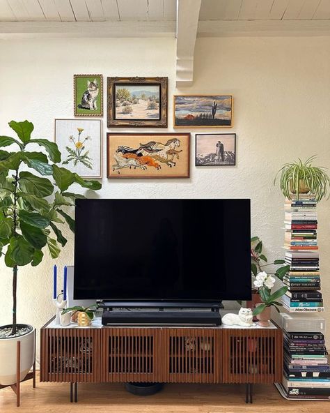 TV Stand Decor Ideas: 8 Ways To Elevate Your Living Room | Castlery US Gallery Wall With Tv Tv Stands, Wall Decor Above Tv Stand, Plant Next To Tv, Decor Above Tv Stand, Tv Stand Bedroom Ideas, Above Tv Decor Living Rooms, Gallery Wall Above Tv, Pictures Above Tv, Space Above Tv