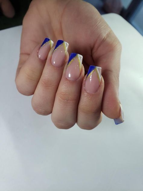 french nails with blue white and gold detalis 2022 nails Blue Gold French Tip Nails, Blue And Gold Square Nails, Royal Blue White And Gold Nails, Short Acrylic Nails For Cheer, Blue And Gold Nail Designs Short, Nails With Blue And Gold, Nail Art Designs Blue And Gold, White And Royal Blue Nails Acrylic, Royal Blue And Gold Acrylic Nails Short