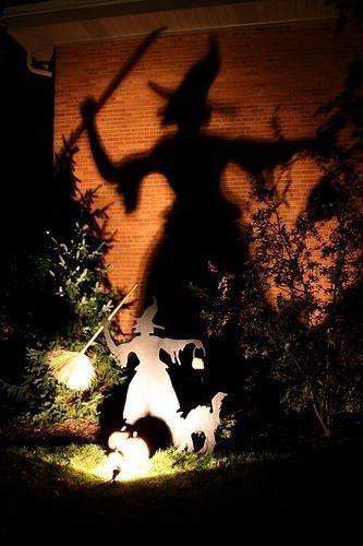 Witch's Halloween Shadow #halloweenwitch Halloween Uplighting Outdoor, Halloween Displays Outside, Natural Halloween Decor, Simple Halloween Decor Outdoor, Wiccan Samhain, Outdoor Halloween Ideas, Simple Outdoor Halloween Decor, Halloween Lights Outdoor, Halloween Outdoors