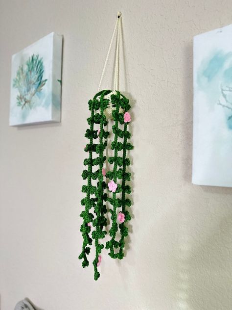 Introduce a touch of elegance and creativity to your home with Handmade Crochet Plant Wall Art. Featuring meticulously crocheted fake flowers and leaves, this wall hanging is a perfect blend of art and nature. Ideal for boho-themed rooms, it adds a unique and sophisticated touch to your bedroom, office, or living room. The soft, natural colors complement any decor, while the handmade quality ensures each piece is one-of-a-kind. Bedroom Accents, Vibe Bedroom, Home Boho, Unique Home Accessories, Crochet Plant, Decoration Plante, Bedroom And Office, Handmade Wall Hanging, Plant Wall