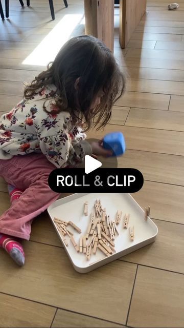 Montessori Dads Way on Instagram: "Roll & Clip
For an activity that took all of ten seconds to set up this was such a winner. GG loves doing this one especially if I sit down with her to take turns. I like to pretend I can’t do the clips then she will take it from me and say “I’ll show you how”
——————————————————————
What you need:
1️⃣Bottom of Boon Lawm @booninc you can also use a cardboard box.
2️⃣Dice
3️⃣Clothespins
————————————————————————
Benefits:
1️⃣Concentration
2️⃣Fine motor
3️⃣Hand eye coordination 
4️⃣Number recognition 
5️⃣Counting
————————————————————————
⭐️GG is 32 Months old here.
————————————————————————
#montessori #montessoriathome #montessoritoddler #montessoriactivity #montessoridadsway #montessoriinspired #activitiesforkids #activitiesfortoddlers #toddleractivities #to Hand Eye Coordination, 4 Number, Number Recognition, Montessori Toddler, Montessori Activities, Clothespins, Cardboard Box, Fine Motor, Toddler Activities